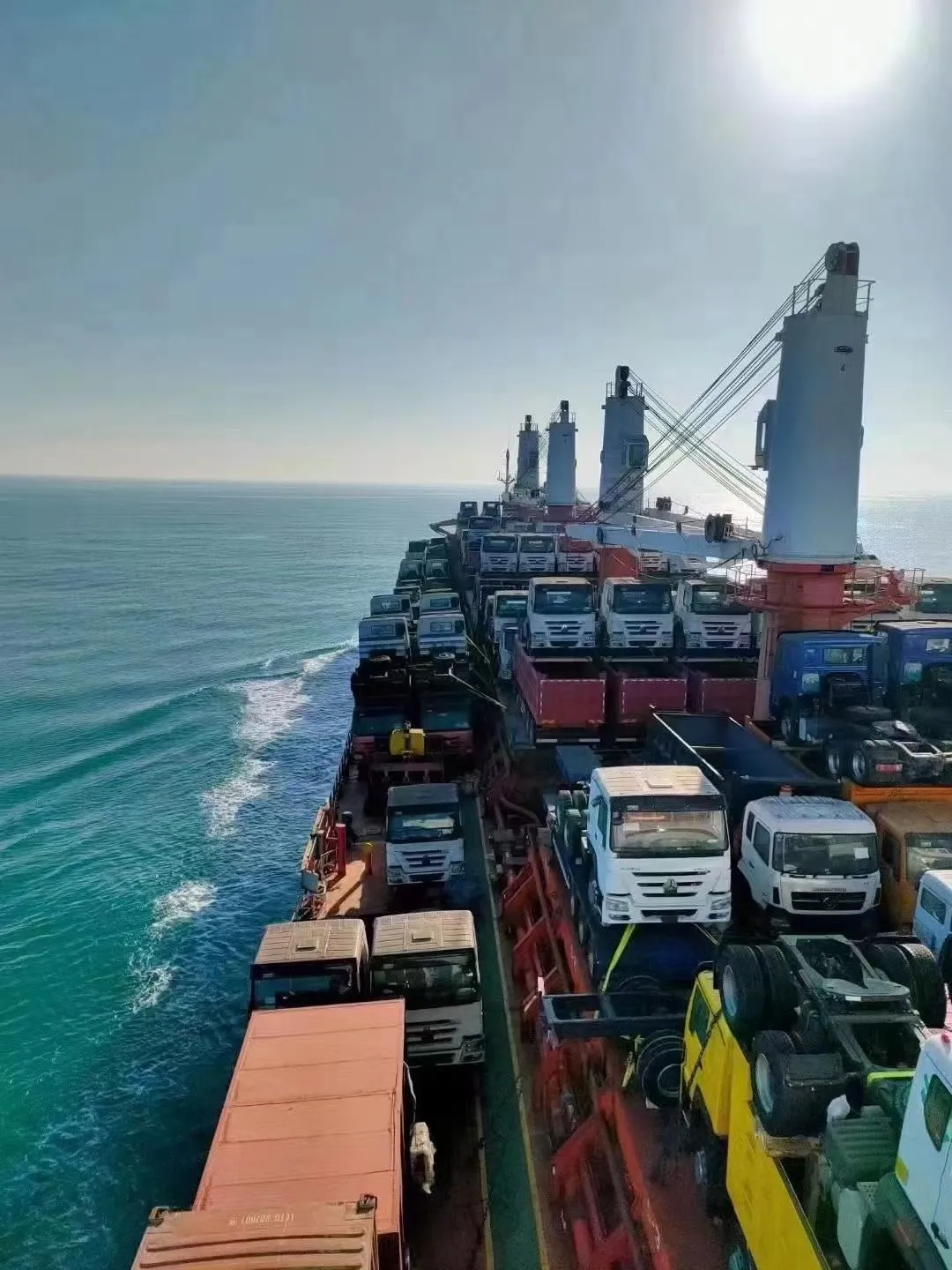 Vessel under way with the deck fully loaded with trucks bound for Tanzania