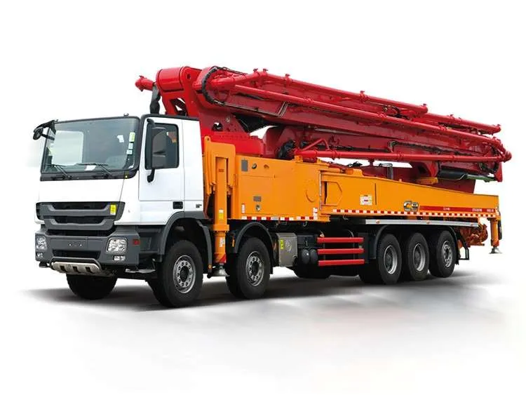 Truck-mounted concrete boom pump with the placing boom folded for transport, studio white background