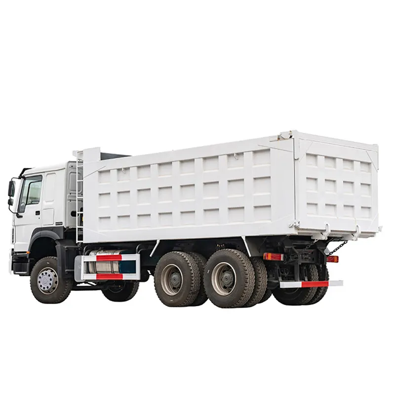 White HOWO dump truck, rear three-quarter view showing the cargo box, studio white background